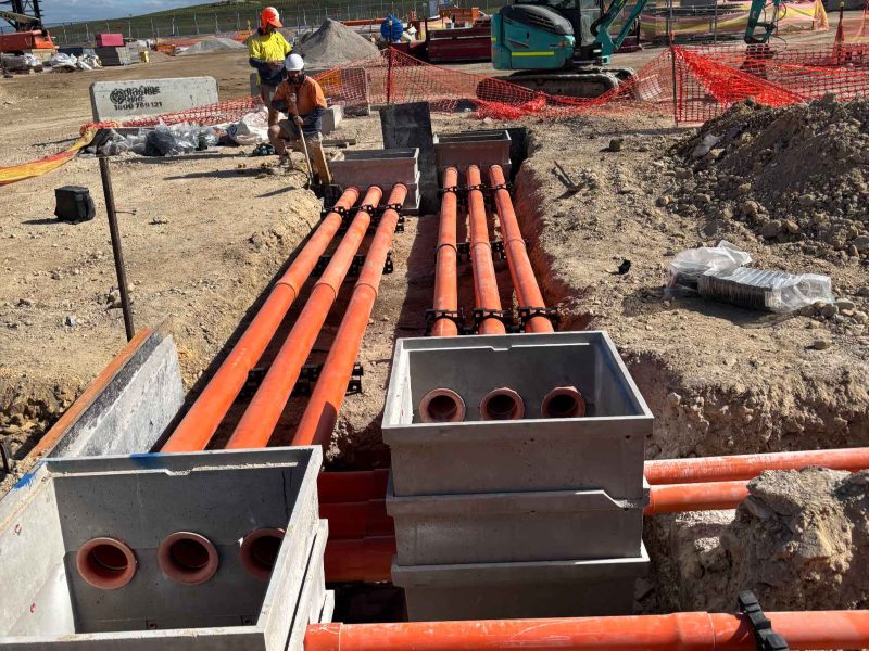 Cable pits and conduit installed in a trench