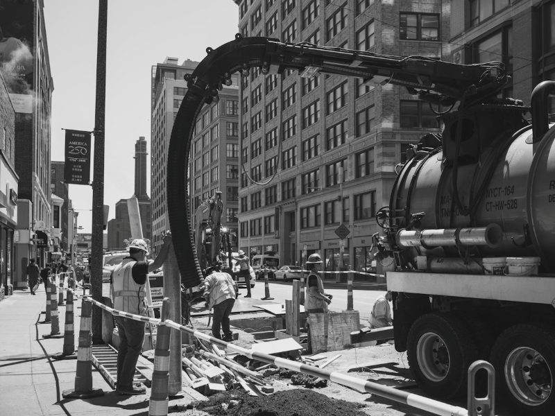 Vac truck carrying out vacuum excavation at a street dig